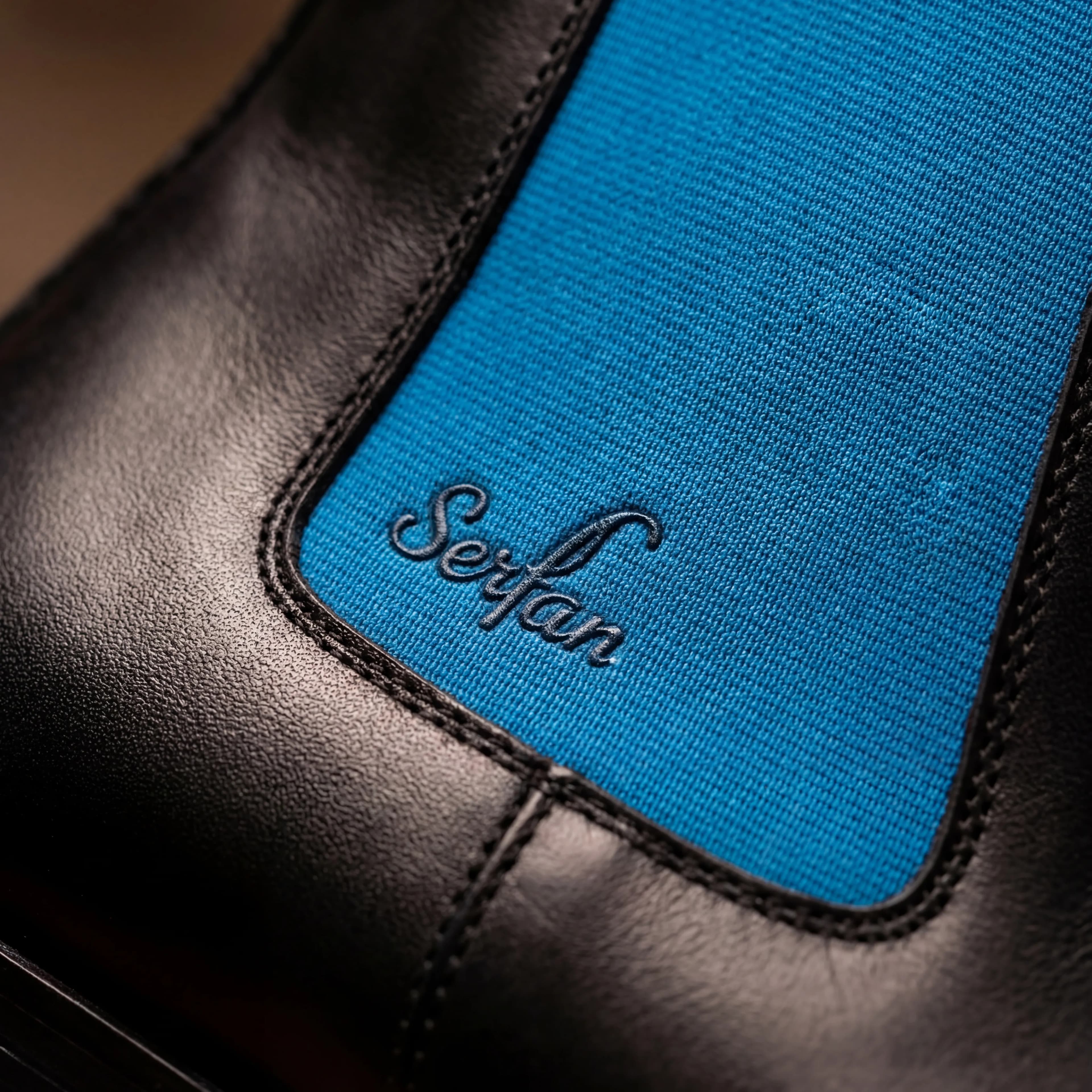 Serfan Signature Detail - Cobalt blue elastic panel with embossed Serfan logo